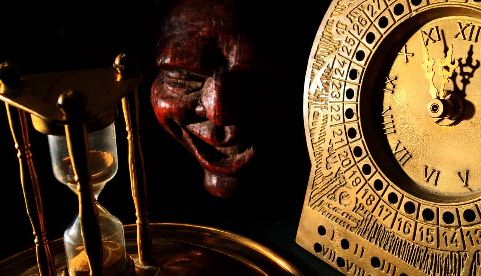 Wooden mask, hourglass and brass clock at The Ritual on Hammerensgade